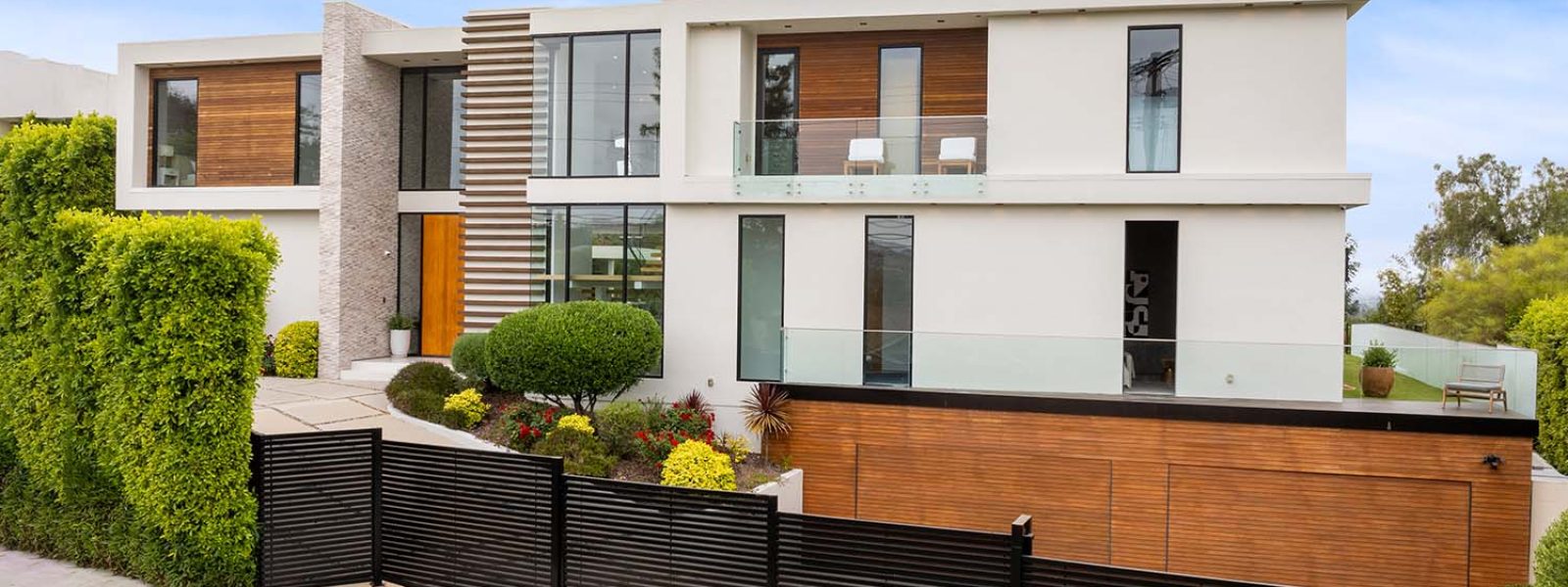contemporary-house-on-a-corner-lot-with-lush-folia-JMLTCWM.jpg